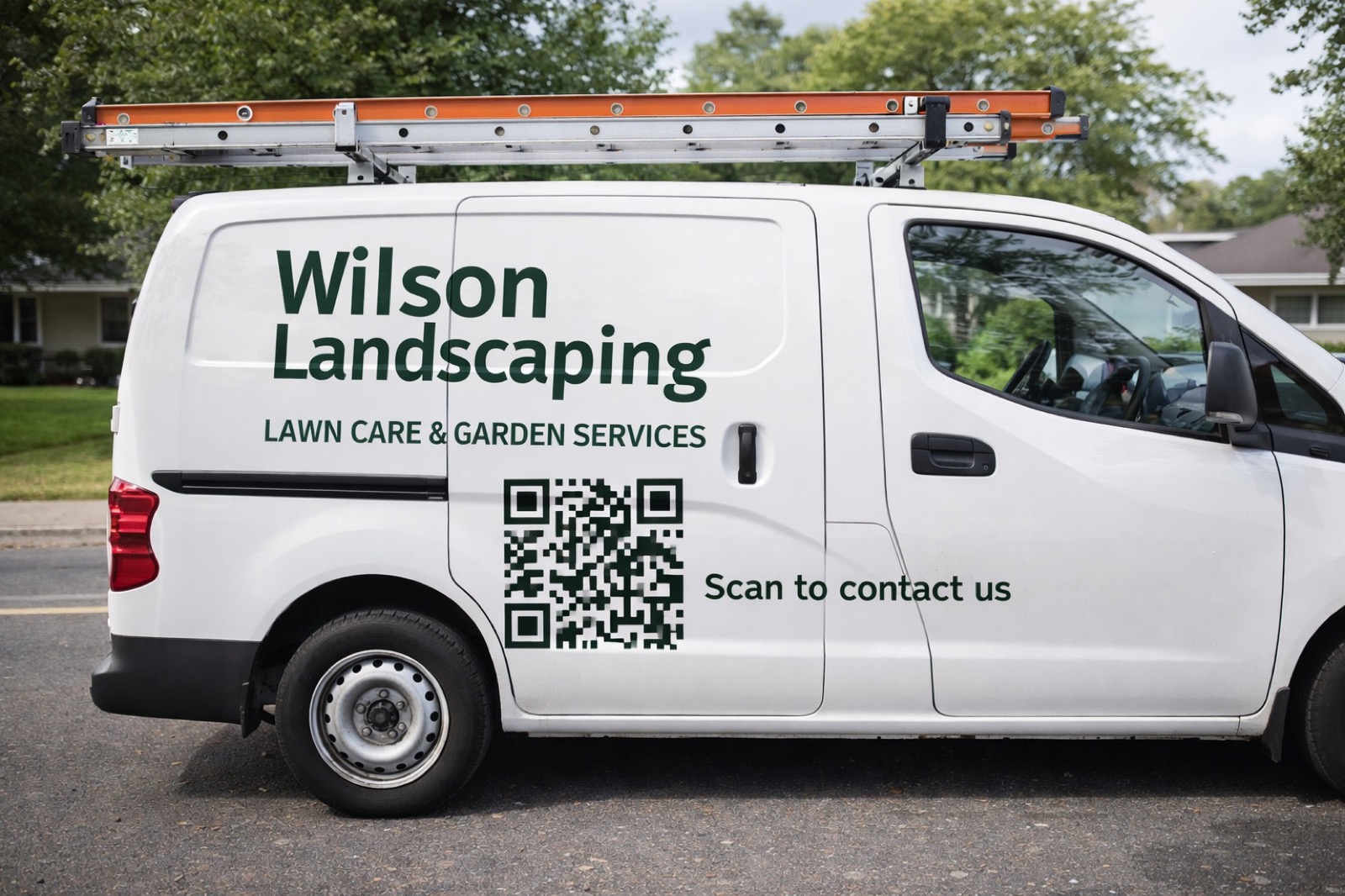 A white landscaper's van at the kerb, the business name and a QR code on the side panel with the words scan to contact us.